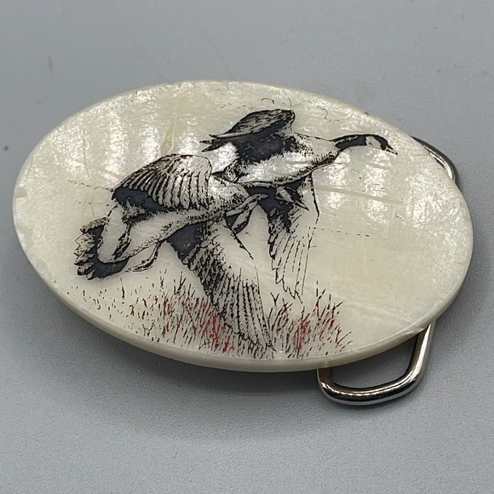 Vintage geese in flight carved belt buckle.